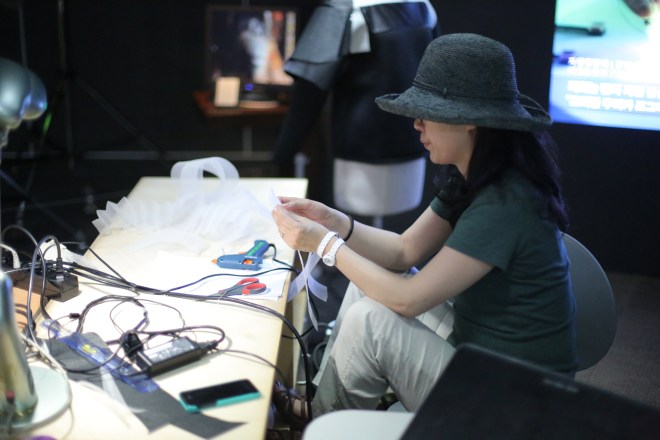 Younghui working on the inner textile.